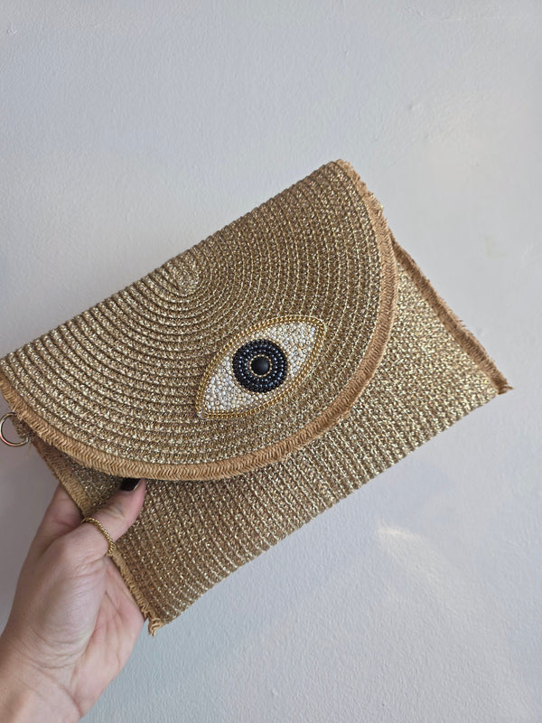Raffia evil eye purse